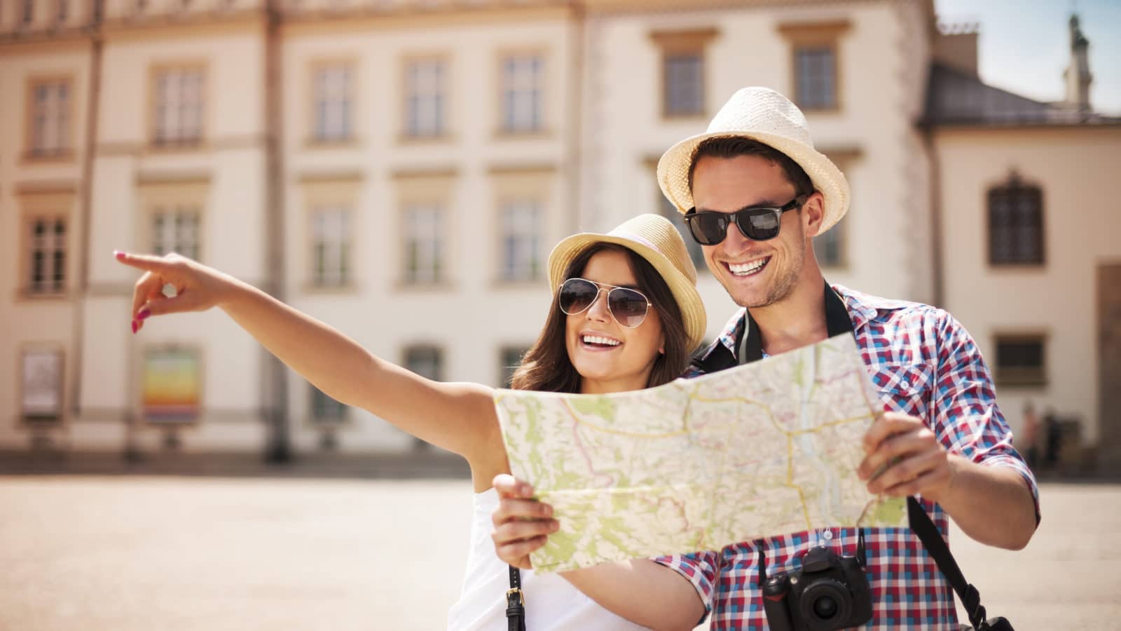 Couple tourists holding map